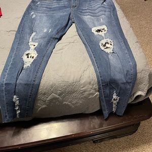 Distressed jeans with leopard print.
